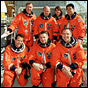 NASA photo of the STS-108 (top) and Expedition Four crews.